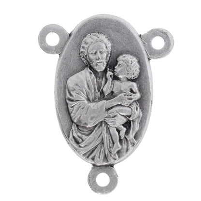 Crociera san Giuseppe in ottone argentato. Altezza 2,2 cm