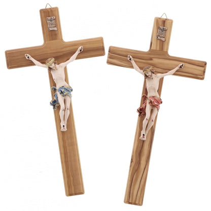 Crocifisso in legno d'olivo, corpo in resina decorata. Altezza 27 cm
