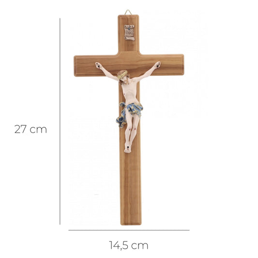 Crocifisso in legno d'olivo, corpo in resina decorata. Altezza 27 cm