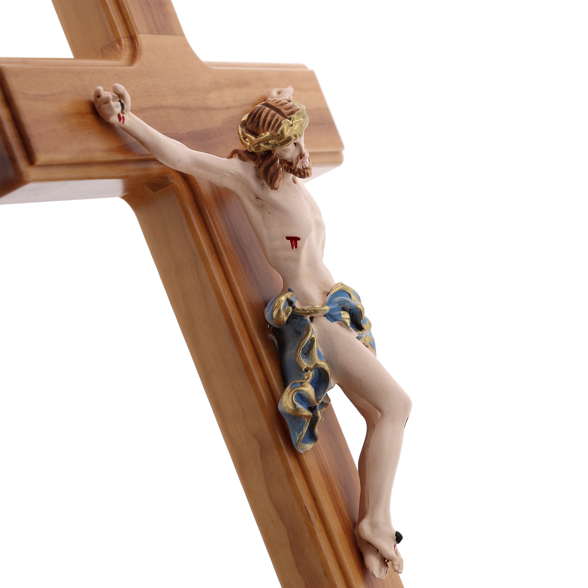 Crocifisso in legno d'olivo, corpo in resina decorata. Altezza 27 cm