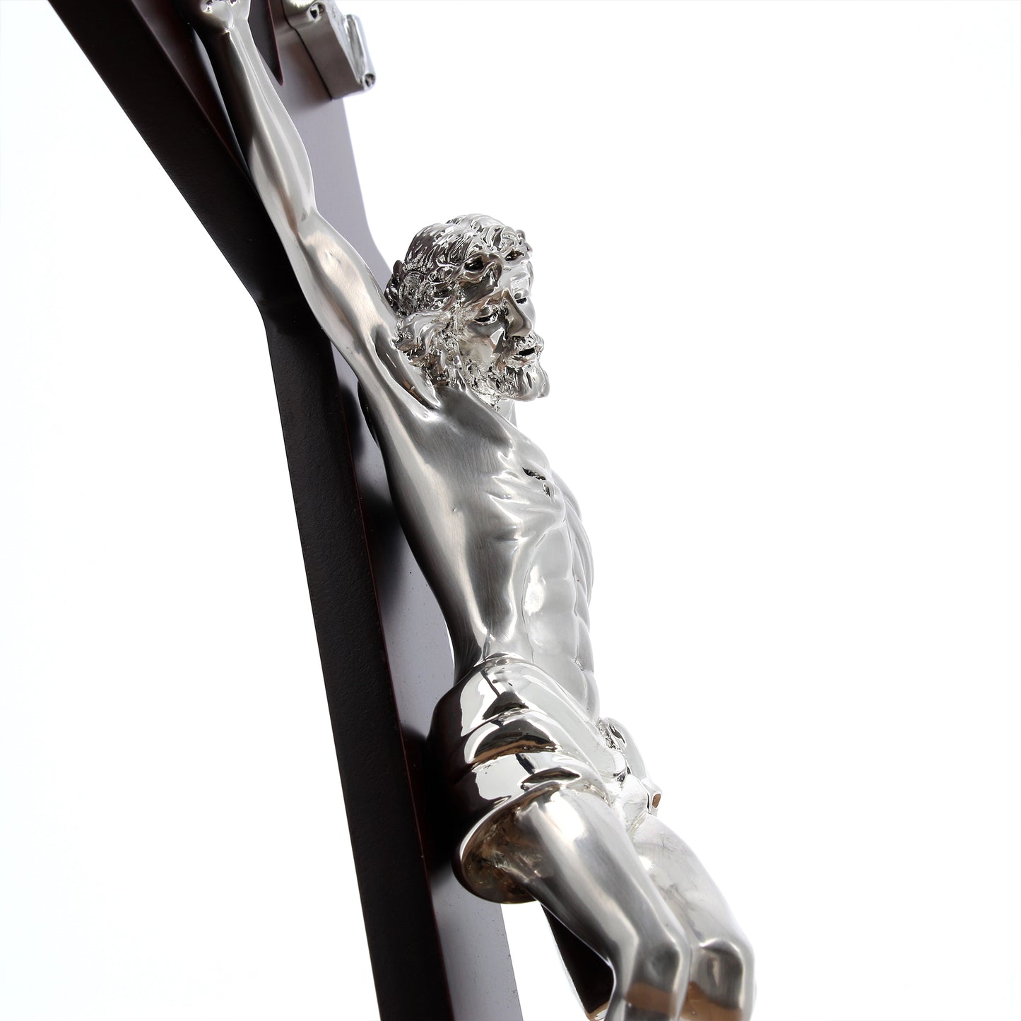 Crocifisso in legno e corpo in resina argentata. Altezza 46 cm