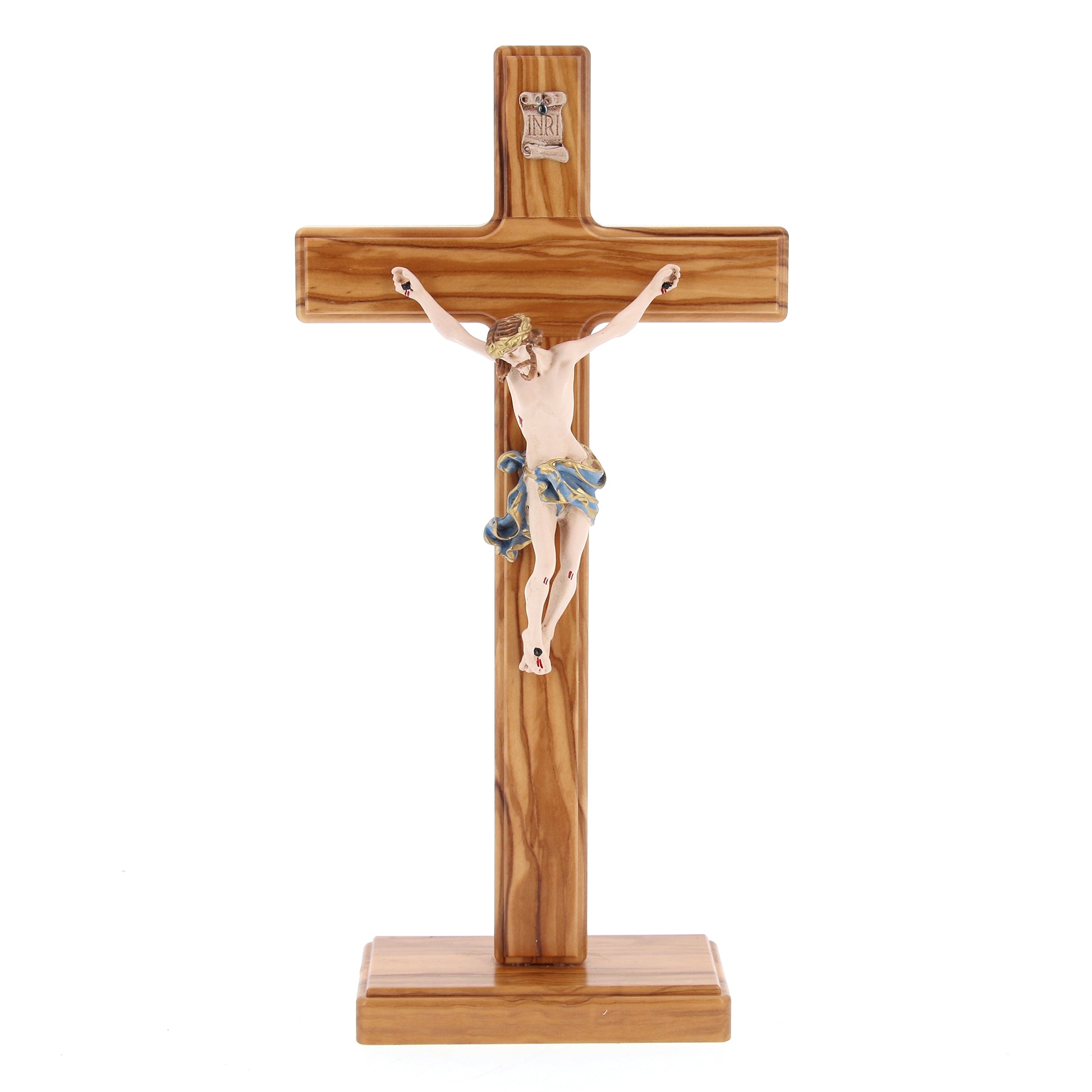 Crocifisso in legno d'olivo e corpo in resina decorato con base. Altezza  29 cm
