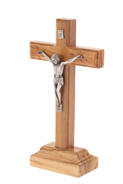 Crocifisso in legno d'ulivo e corpo in metallo con base. Altezza 14 cm
