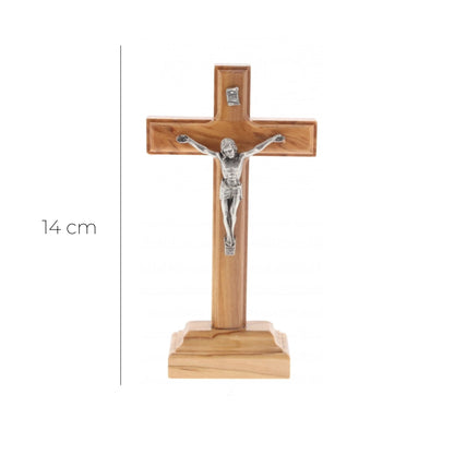 Crocifisso in legno d'ulivo e corpo in metallo con base. Altezza 14 cm

