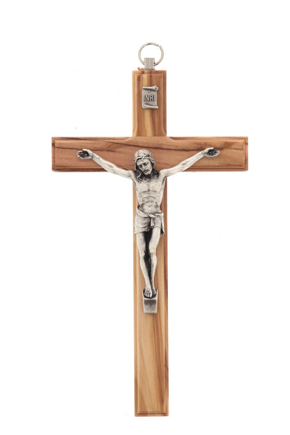 Crocifisso in legno d'ulivo e corpo in metallo. Altezza 16 cm
