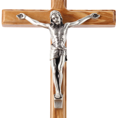 Crocifisso in legno d'ulivo e corpo in metallo. Altezza 16 cm
