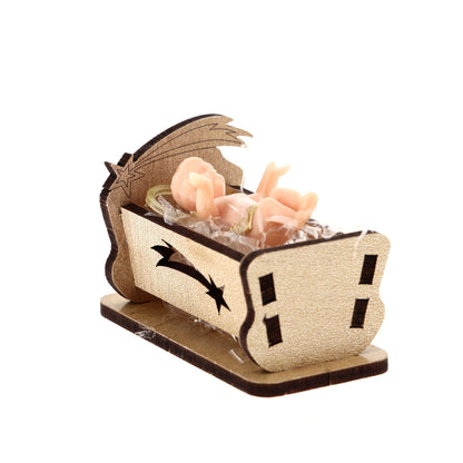 Statua Gesù Bambino in plastica su culla in legno. Altezza 4 cm