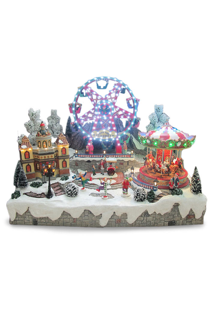 Villaggio Natalizio "Giostra e ruota panoramica" animato da luci, suoni e movimenti. Dimensioni 45x59x35 cm