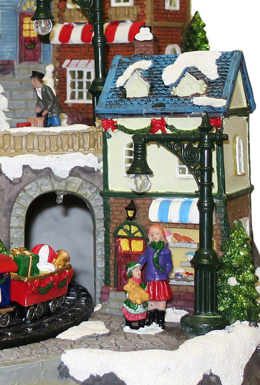 Villaggio Natalizio "Stazione e Negozi" animato da luci, suoni e movimenti. Dimensioni 38x41x35 cm