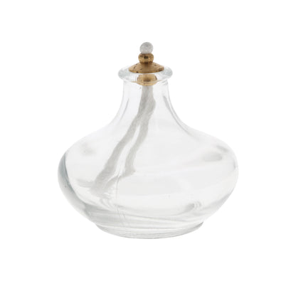 Lume a cera liquida, in vetro. Dimensioni 7x7 cm.
