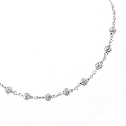 Bracciale decina acini tondi lavorati in argento 925 rodiato. Lunghezza 17+3 cm.