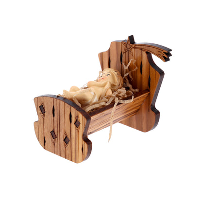 Culla in legno d'olivo con Gesù Bambino. Dimensioni 5,5x6 cm