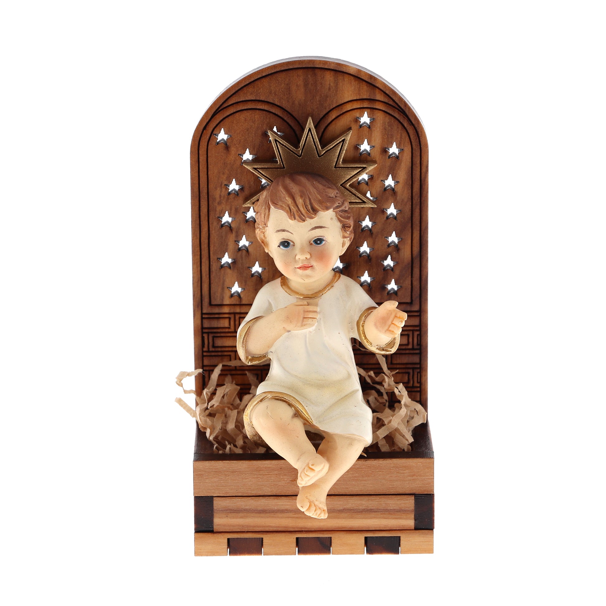 Base in legno d'olivo con stella in rilievo con Gesù Bambino seduto. Dimensioni 9,5x4,5 cm
