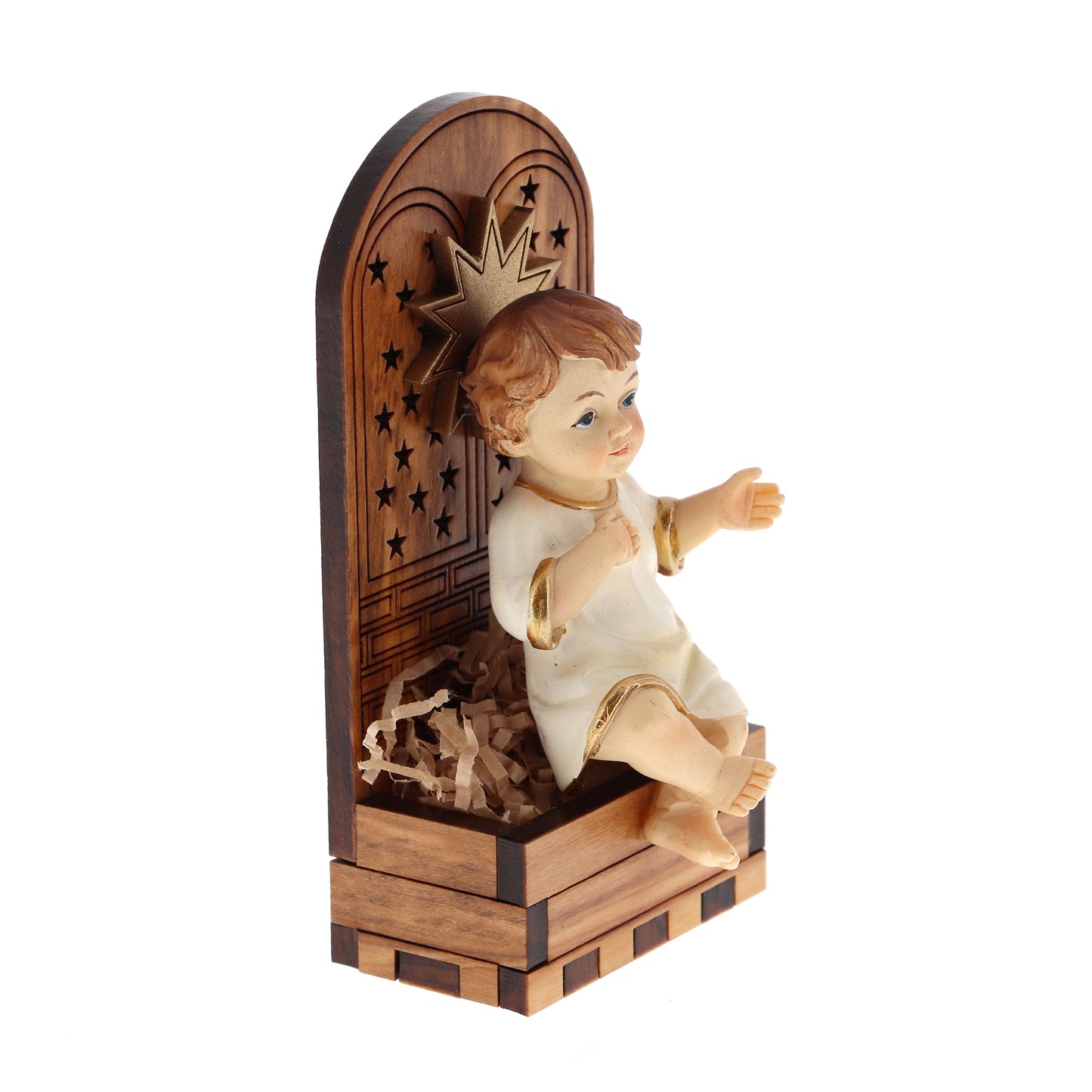 Base in legno d'olivo con stella in rilievo con Gesù Bambino seduto. Dimensioni 9,5x4,5 cm