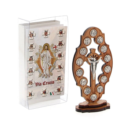 Via Crucis in legno d'olivo sagomato e colorato con stazioni in metallo e base. Dimensioni 7x13,5 cm