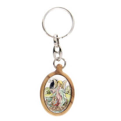 Portachiavi in legno d'olivo con placca in argento laminato colorata. Dimensioni 4,2x2,8 cm