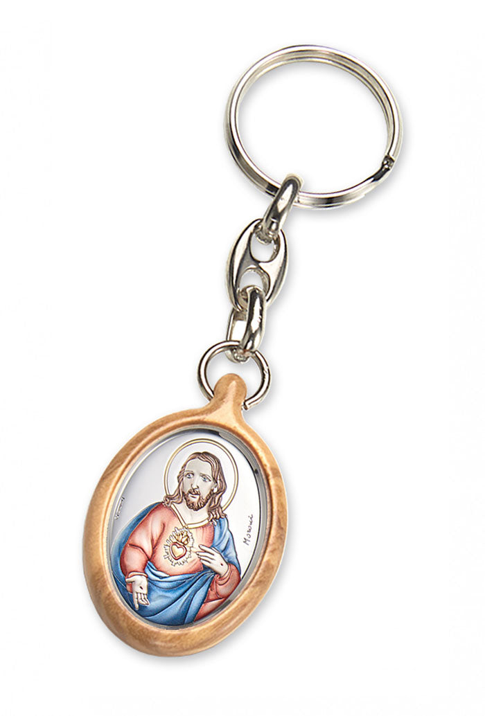 Portachiavi in legno d'olivo con placca in argento laminato colorata. Dimensioni 4,2x2,8 cm