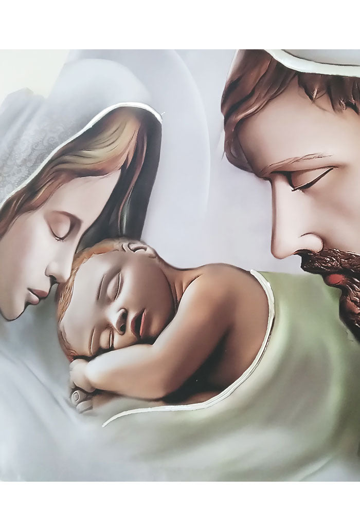 Quadro sagomato Sacra Famiglia con decorazioni argentate
in rilievo fatte a mano. Dimensioni 63x33 cm
