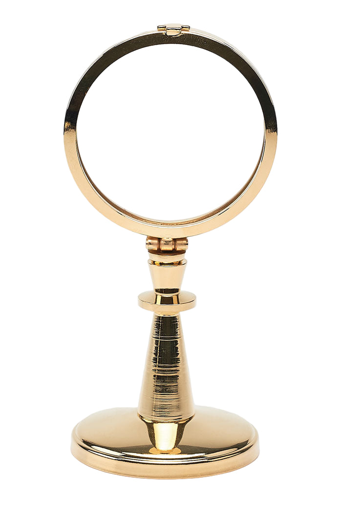 Teca da esposizione su stelo in ottone dorato. Dimensioni h. 16,5 cm e diametro 8 cm
