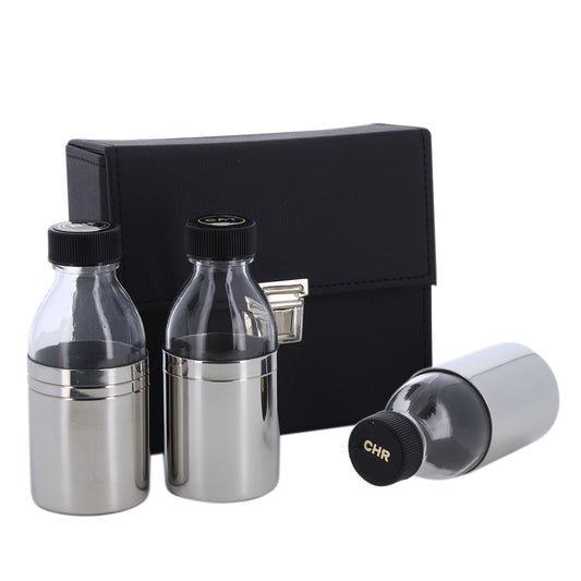 Tre bottiglie per oli santi in astuccio rigido. Dimensioni 16x14x6,5 cm