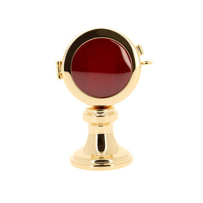 Reliquiario su base in ottone dorato. Dimensioni 5,5x9,5