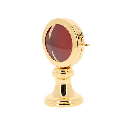 Reliquiario su base in ottone dorato. Dimensioni 5,5x9,5