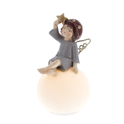 Statua Angelo seduto su sfera luminosa a led. Altezza 14,4 cm