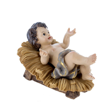 Gesù Bambino in resina su mangiatoia. Altezza 16 cm