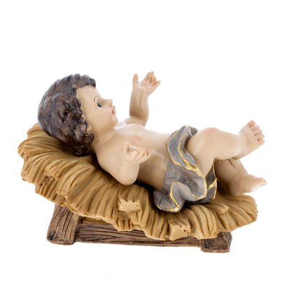 Gesù Bambino in resina su mangiatoia. Altezza 16 cm