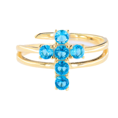 Anello Lumae Patronus, croce con zirconi celesti, argento 925 dorato