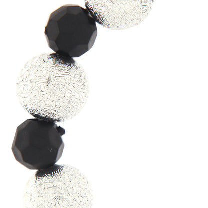 Bracciale decina elastico, grani color argento lavorati e grani neri sfaccettati, 6 mm