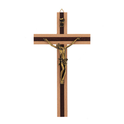 Crocifisso in legno chiaro con inserti in legno scuro e corpo in metallo. Altezza 20 cm