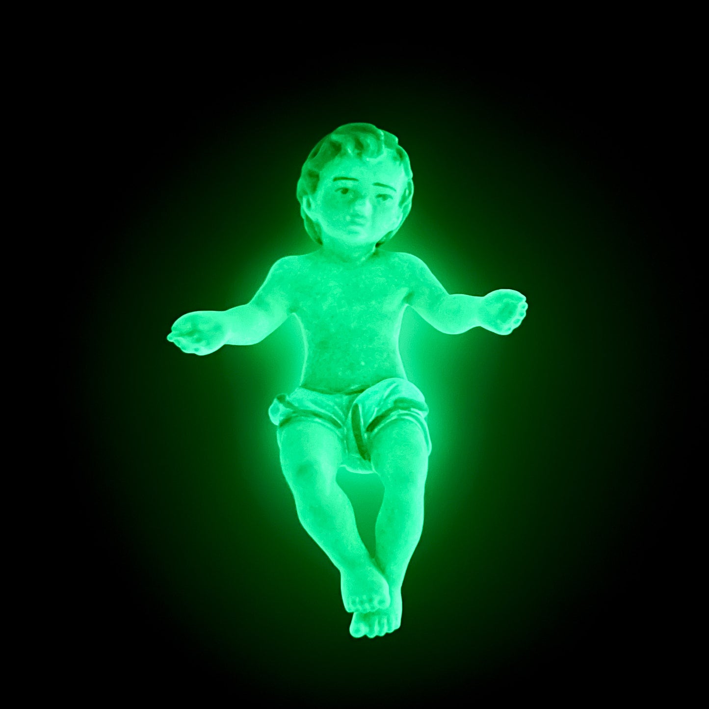 Statua Gesù Bambino in resina decorata, fluorescente al buio. Altezza 5 cm