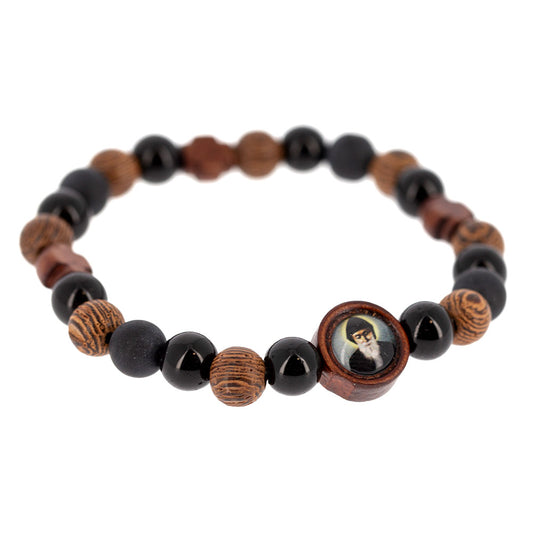 Bracciale elastico San Charbel con grani in legno lavorato e croci