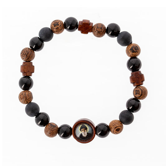Bracciale elastico San Charbel con grani in legno lavorato e croci