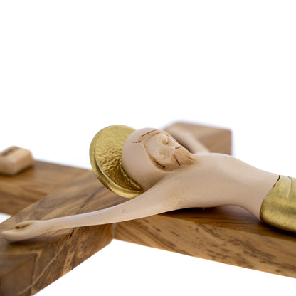 Crocifisso in legno d'ulivo con corpo in resina. Altezza 23,5 cm