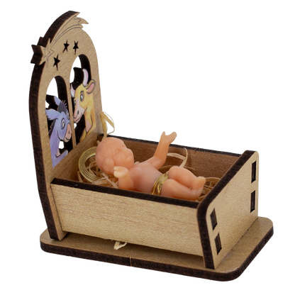 Statua Gesu' Bambino in plastica su culla in legno. Dimensioni 3,5x5 cm