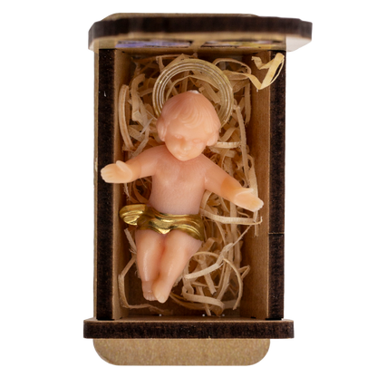Statua Gesu' Bambino in plastica su culla in legno. Dimensioni 3,5x5 cm