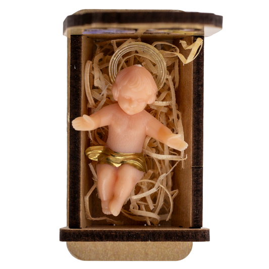 Statua Gesu' Bambino in plastica su culla in legno. Dimensioni 3,5x5 cm