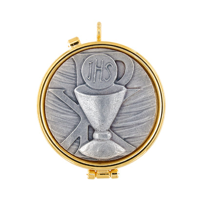 Teca con placca in peltro raffigurante Calice. Diametro 4 cm
